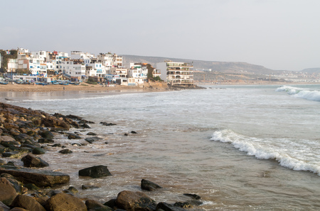 View along Taghazout with rocks and beach.の写真素材