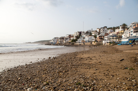Taghazout beach with seagulls and restaurants.の写真素材