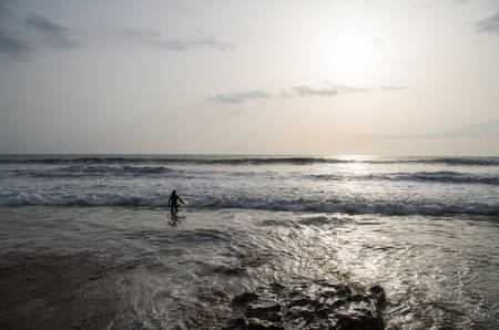 Surfer going into the water.の写真素材