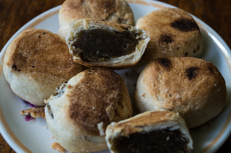 Typical Indonesian sweets: Bakpia centered on plate close-up.の写真素材