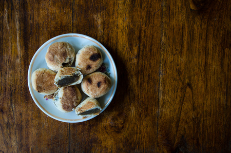 Typical Indonesian sweets: Bakpia centered on plate with copy space right.の写真素材