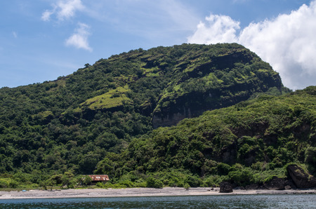 Mountainous coastline on sumbawa with deserted beach.の写真素材
