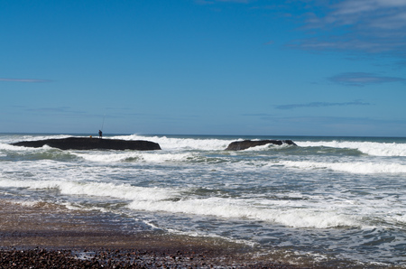 Fishing at the coastline of Morocco.の写真素材