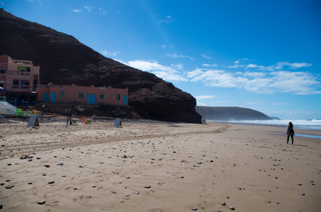 Walking along the beach with legzira in background.の写真素材