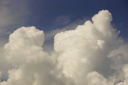 white golden clouds large and blue sky