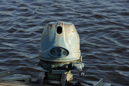 old boat motor on the riverの写真素材