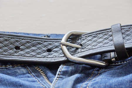 the belt on the jeans.denim texture. blue jeans