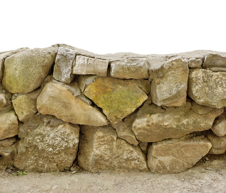 masonry stone wall of large stone limestone. white isolate backgroundの写真素材