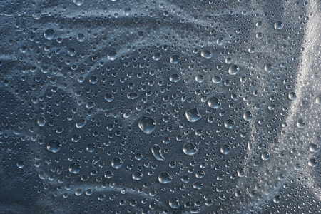 water drops on metal surface texture background shiny metal surface