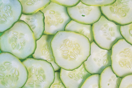 Cucumber slices texture background. fresh cucumbers diet dishの写真素材