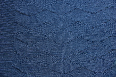 warm blue dark woolen sweater fabric texture background wool close-up. season winter autumn spring