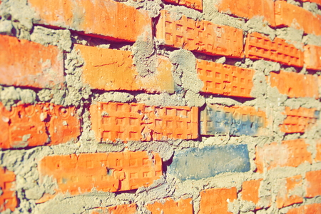 surface of an old red brick wall grunge background texture close up