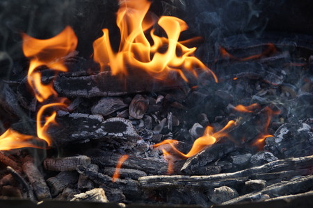fire flame smoke embers to fry on the street close-upの写真素材