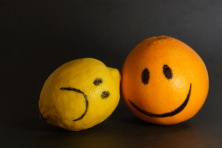 emotions abstract sad lemon and cheerful orange design concept  optimism and pessimismの写真素材