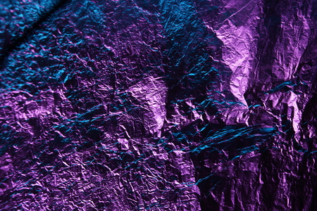 abstract background texture metal aluminum foil blue and purple pink colorの写真素材