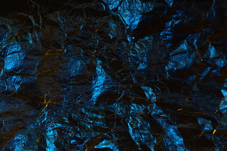 abstract background texture metal aluminum foil blue and yellow colorsの写真素材