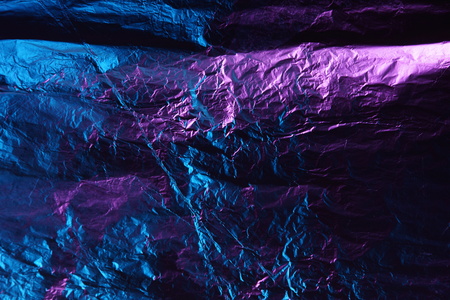 abstract background texture metal aluminum foil blue and purple pink colorの写真素材