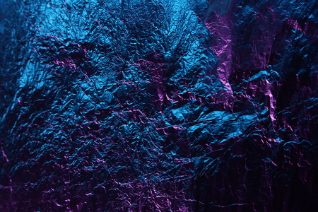 abstract background texture metal aluminum foil blue and purple pink colorの写真素材