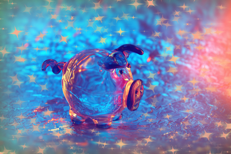 glass pig on a metal background blue red pink pig year close-upの写真素材