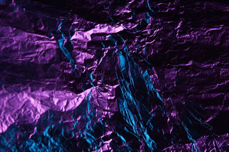 abstract background texture metal aluminum foil blue and purple pink colorの写真素材