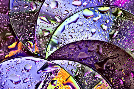abstract circles background. CDs SD multicolor water drops background. Creative background.