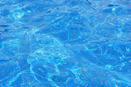 Abstract blue beautiful water reflection pool on light background.