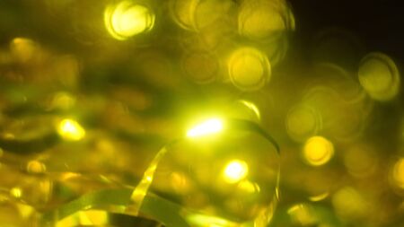 abstract background natural festive gold bokeh sequins tinselの写真素材