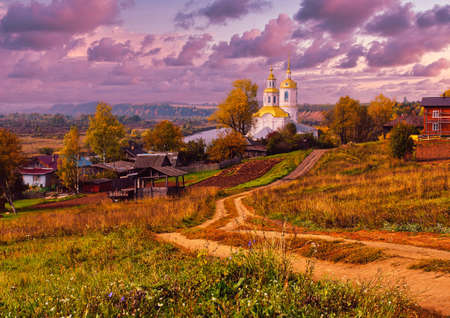 beautiful rural landscape autumn orthodox white Church road to the temple Russiaの写真素材