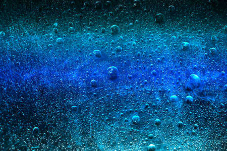 frozen water drops blue background close-up