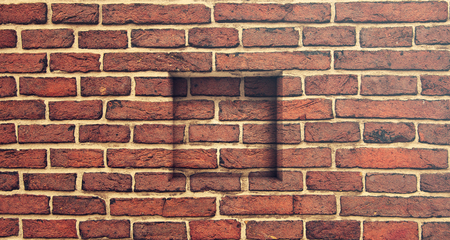 Retro brick wall and square window holeの写真素材