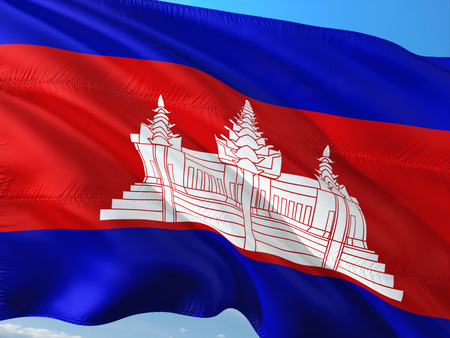 Flag of Cambodia waving in the wind against deep blue sky. High quality fabric.の写真素材