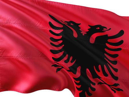 Flag of Albania waving in the wind, isolated white background.の写真素材