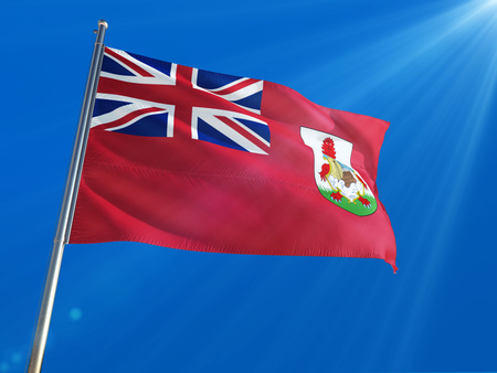 Bermuda National Flag Waving on pole against deep blue sky background. High Definition