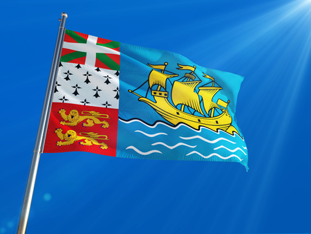 Saint Pierre And Miquelon National Flag Waving on pole against deep blue sky background. High Definitionの写真素材