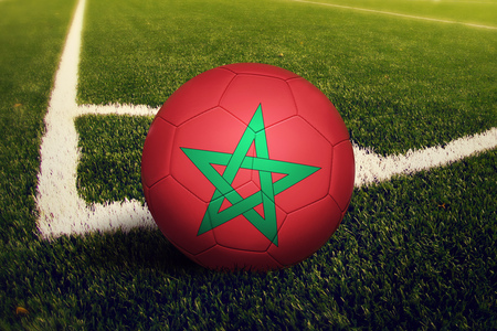Morocco ball on corner kick position, soccer field background. National football theme on green grass.の写真素材