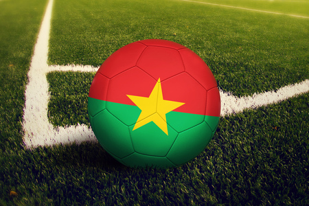 Burkina Faso ball on corner kick position, soccer field background. National football theme on green grass.の写真素材