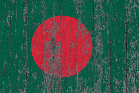 Flag of Bangladesh painted on worn out wooden texture background.の写真素材