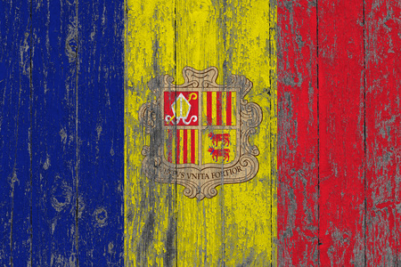 Flag of Andorra painted on worn out wooden texture background.の写真素材