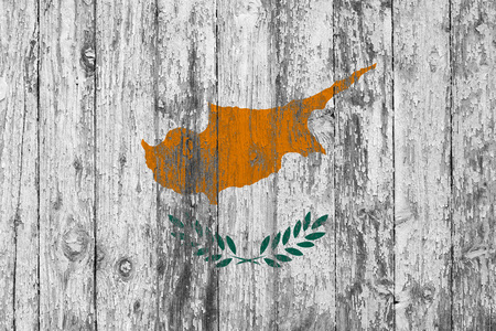 Flag of Cyprus painted on worn out wooden texture background.の写真素材