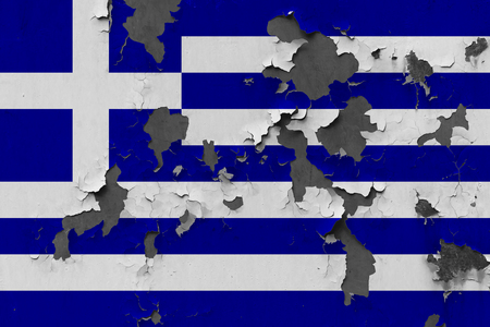 Close up grungy, damaged and weathered Greece flag on wall peeling off paint to see inside surface.の写真素材