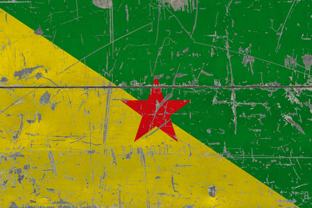 Grunge French Guiana flag on old scratched wooden surface. National vintage background.の写真素材