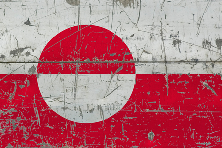 Grunge Greenland flag on old scratched wooden surface. National vintage background.の写真素材