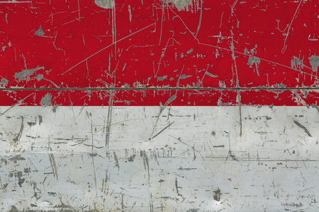 Grunge Indonesia flag on old scratched wooden surface. National vintage background.の写真素材