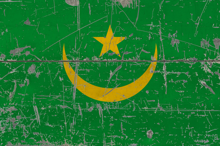 Grunge Mauritania flag on old scratched wooden surface. National vintage background.の写真素材