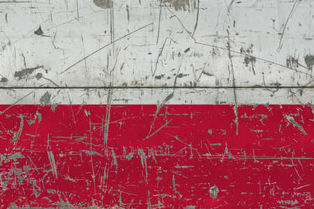 Grunge Poland flag on old scratched wooden surface. National vintage background.の写真素材