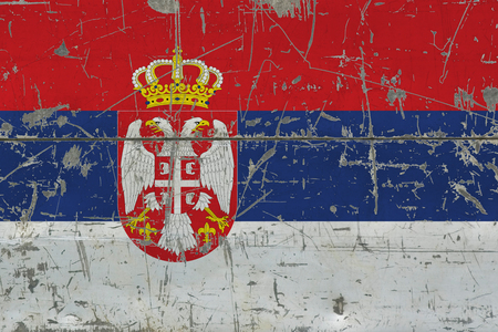 Grunge Serbia flag on old scratched wooden surface. National vintage background.の写真素材
