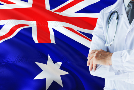 Heard Island and Mcdonald Islands Doctor standing with stethoscope on Australia flag background. National healthcare system concept, medical theme.の写真素材