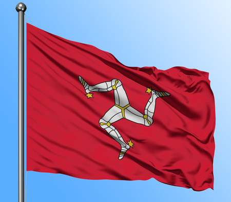 Isle Of Man flag waving in the deep blue sky background. Isolated national flag. Macro view shot.の写真素材