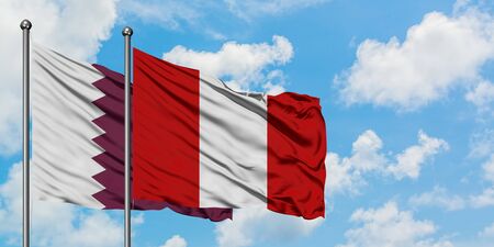 Qatar and Peru flag waving in the wind against white cloudy blue sky together. Diplomacy concept,...
