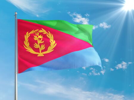 Eritrea national flag waving in the wind against deep blue sky. High quality fabric. International relations concept.の写真素材
